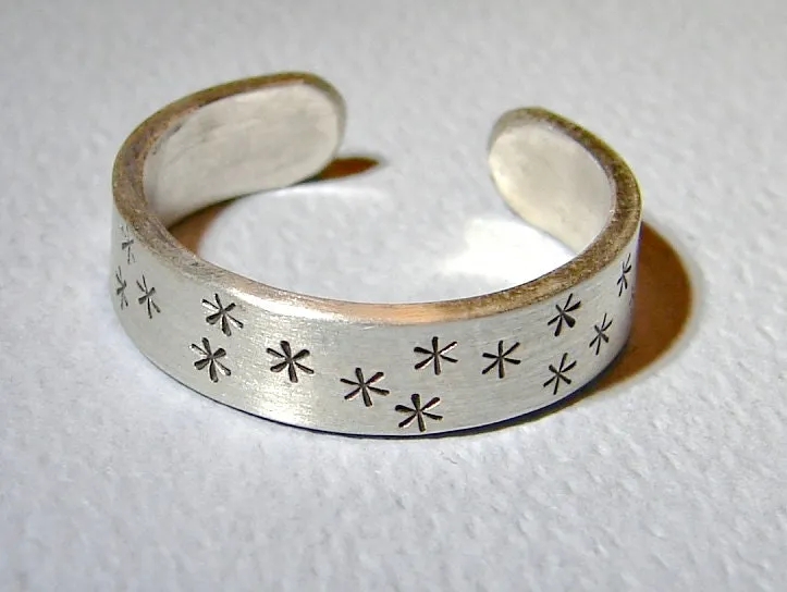 Adjustable star stamped sterling silver ring