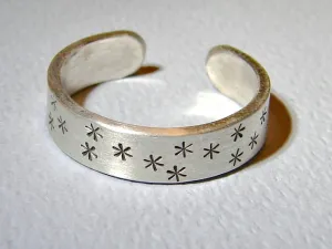 Adjustable star stamped sterling silver ring