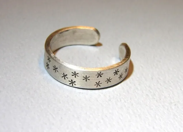 Adjustable star stamped sterling silver ring