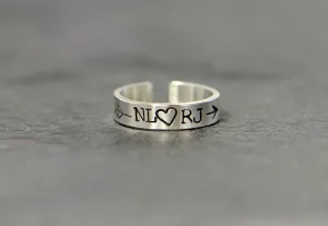 Sterling silver customized toe ring with initials framed by arrow