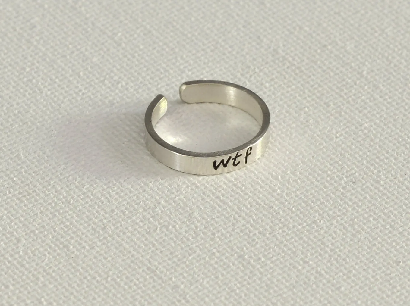 WTF sterling silver toe ring